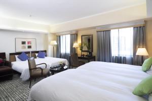 Postel nebo postele na pokoji v ubytování Kanazawa New Grand Hotel Prestige