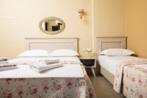 Cama ou camas em um quarto em Pension Sotiria