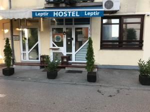 a hospital building with potted plants in front of it at Leptir in Zagreb