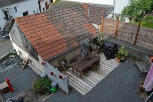 an overhead view of a house with a wooden deck at bed en breakfast Floris in Wallenborn
