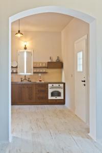an empty kitchen with a sink and a stove at Lux View Suites in Kyra Panagia