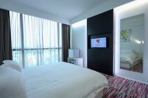 Postel nebo postele na pokoji v ubytování Pegasus Hotel Shah Alam