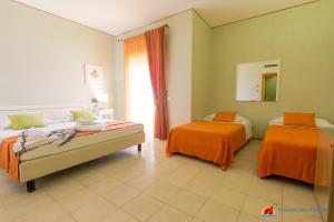 Postel nebo postele na pokoji v ubytování Paradise Beach Resort Selinunte