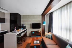 TV a/nebo společenská místnost v ubytování Felix by STX Hotel & Suite