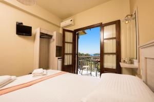 Cama ou camas em um quarto em Pension Sotiria