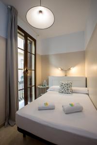 A bed or beds in a room at Mesones 54