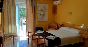 Postel nebo postele na pokoji v ubytování Hotel Alaska