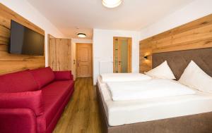 Letto o letti in una camera di Alpenhotel Ernberg