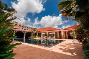 an exterior view of a resort with a swimming pool at LAOTEL VIENTIANE in Vientiane
