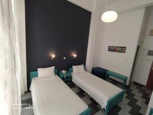 מיטה או מיטות בחדר ב-Ariadni Rooms & Apartments