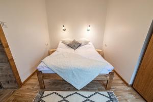 Posteľ alebo postele v izbe v ubytovaní Apartament Stary Mlyn