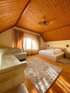 a attic bedroom with two beds and a window at Guest house Mountain View in Polyana