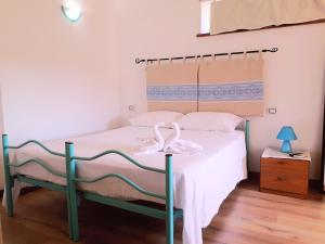 Postel nebo postele na pokoji v ubytování B&B I Limoni