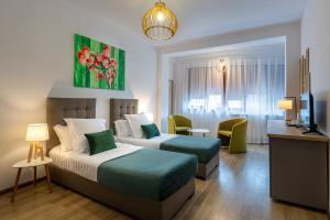 Postel nebo postele na pokoji v ubytování Lagom Hotel