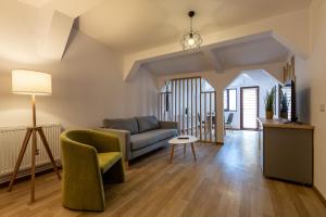 a living room with a couch and a table at Lagom Hotel in Bucharest