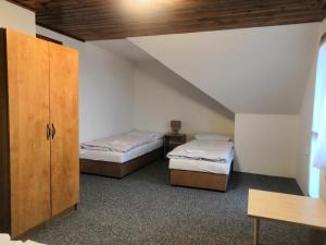 Postel nebo postele na pokoji v ubytování Horská chata U Rychlých Filipovice