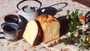 a plate with two slices of bread on a table at Alegria in Arbellara