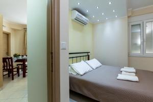 A bed or beds in a room at Vasso Apartments 3