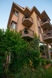 a building with balconies on the side of it at Golden Moon Hotel in Fethiye