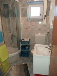 Koupelna v ubytování Apartman Zvončica