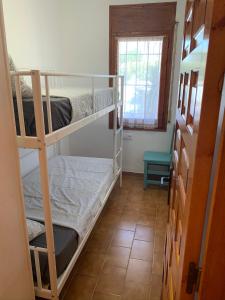 A bed or beds in a room at BADIA BEACH- Empuriabrava