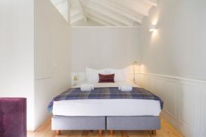 Postel nebo postele na pokoji v ubytování Porto Toja Apartments