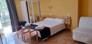 Postel nebo postele na pokoji v ubytování Hotel Alaska
