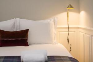 Postel nebo postele na pokoji v ubytování Porto Toja Apartments + 7 fotografií