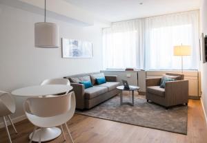 Uma área de estar em Brera Serviced Apartments Frankfurt Oper