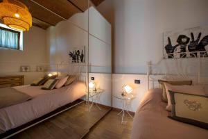 Ένα ή περισσότερα κρεβάτια σε δωμάτιο στο Podere Casanova & Wine Experience - Montepulciano +113 φωτογραφίες