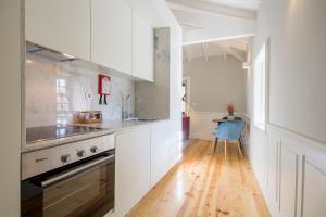 Kuchyň nebo kuchyňský kout v ubytování Porto Toja Apartments