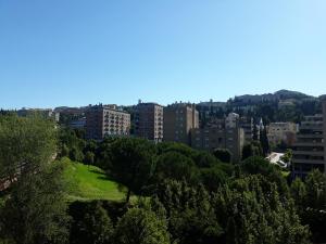 a view of a city with trees and buildings at Elite Apartments in Perugia