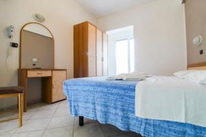 Postel nebo postele na pokoji v ubytování Hotel Abbondanza