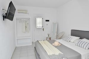 Postel nebo postele na pokoji v ubytování Kastraki Dunes Naxos