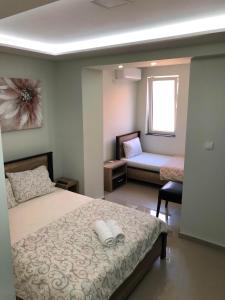 Postel nebo postele na pokoji v ubytování Apartmani Jovanovic