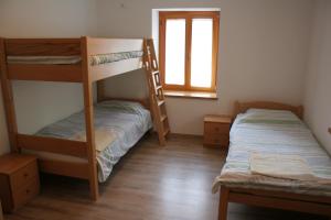 Postel nebo postele na pokoji v ubytování Apartments Jez