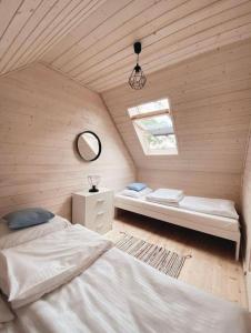 Tempat tidur dalam kamar di Nad Rozlewiskiem