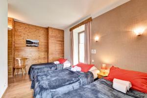 Postel nebo postele na pokoji v ubytování Hôtel Restaurant Gîtes Les 5 Saisons
