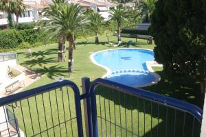 a view of a swimming pool from a balcony at Apartamentos Porta Mediterranea in Alcossebre +6 photos