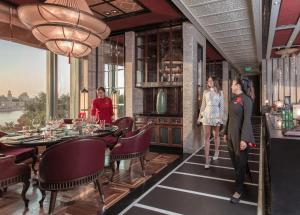 a rendering of a dining room with a table and people at Four Seasons Hotel Cairo at Nile Plaza in Cairo