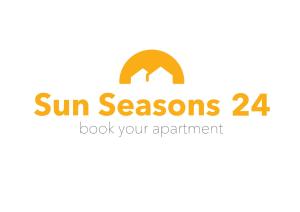 シュクラルスカ・ポレンバにあるApartamenty Sun Seasons 24 - Willa Laserの日の季節を読むサイン
