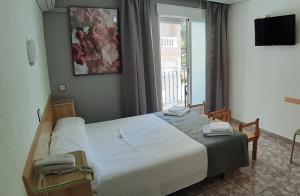 Postel nebo postele na pokoji v ubytování Hotel Alaska