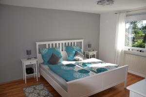 Ein Bett oder Betten in einem Zimmer der Unterkunft Ferienhaus Pusteblume