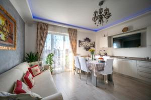 a kitchen and dining room with a table and chairs at La Nadia in Marghera