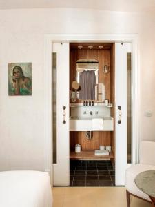 a bathroom with a sink and a mirror at La Bionda Hotel - Adults Only in Begur
