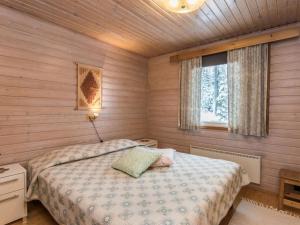 Postel nebo postele na pokoji v ubytování Holiday Home Kuusirinne by Interhome