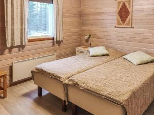 Postel nebo postele na pokoji v ubytování Holiday Home Kuusirinne by Interhome