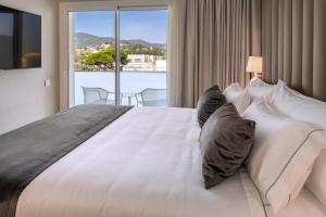 Llit o llits en una habitació de Hotel Playafels