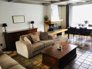 a living room with a couch and a coffee table at Holiday Home Brouwershaven by Interhome in Brouwershaven