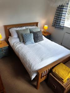 a bedroom with a large bed with two night stands at Old Telephone Exchange in North Thoresby